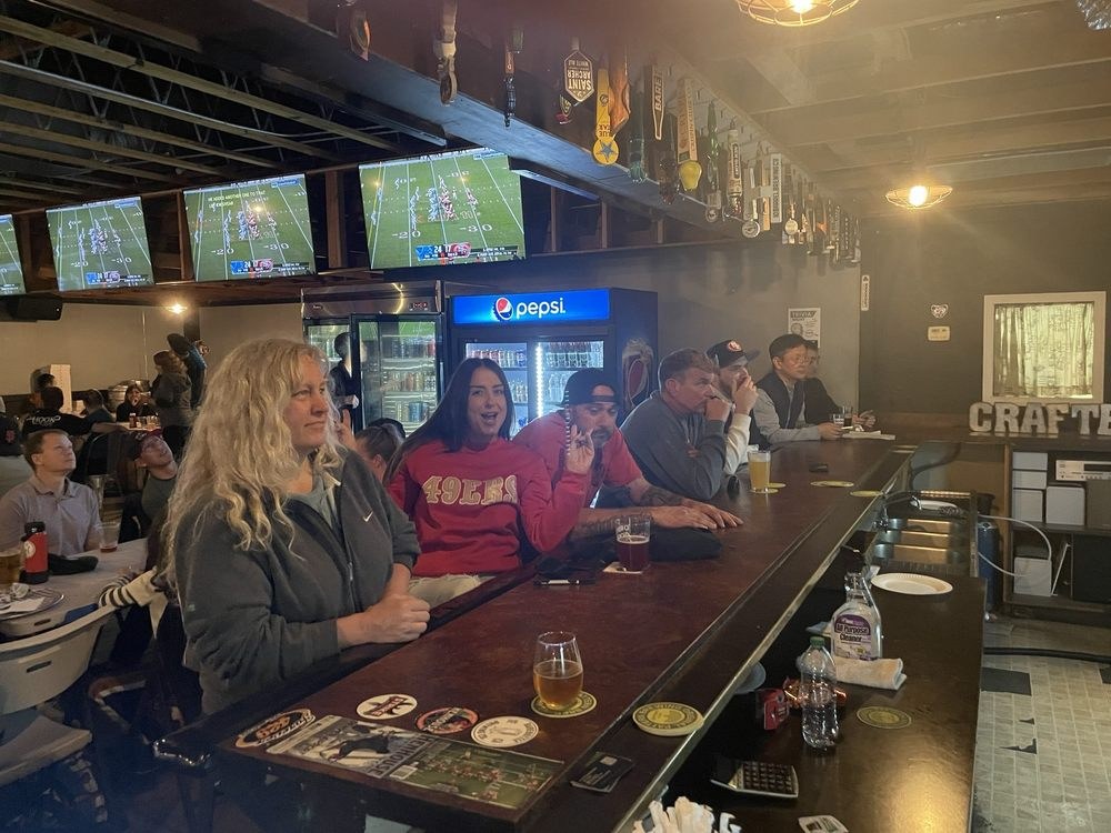Fans cheering at the bar